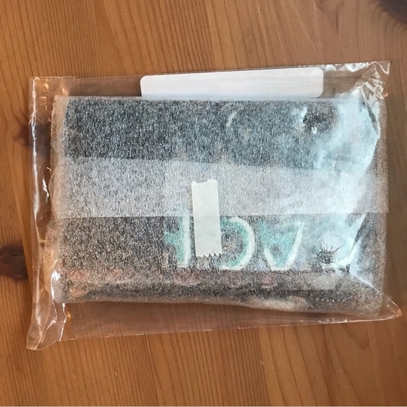 Signature coated canvas and refined pebble leather Five credit card slots Zip po - Picture 8 of 11